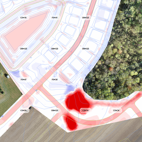 Aerial map with outlined plots, road junction, red-highlighted area.